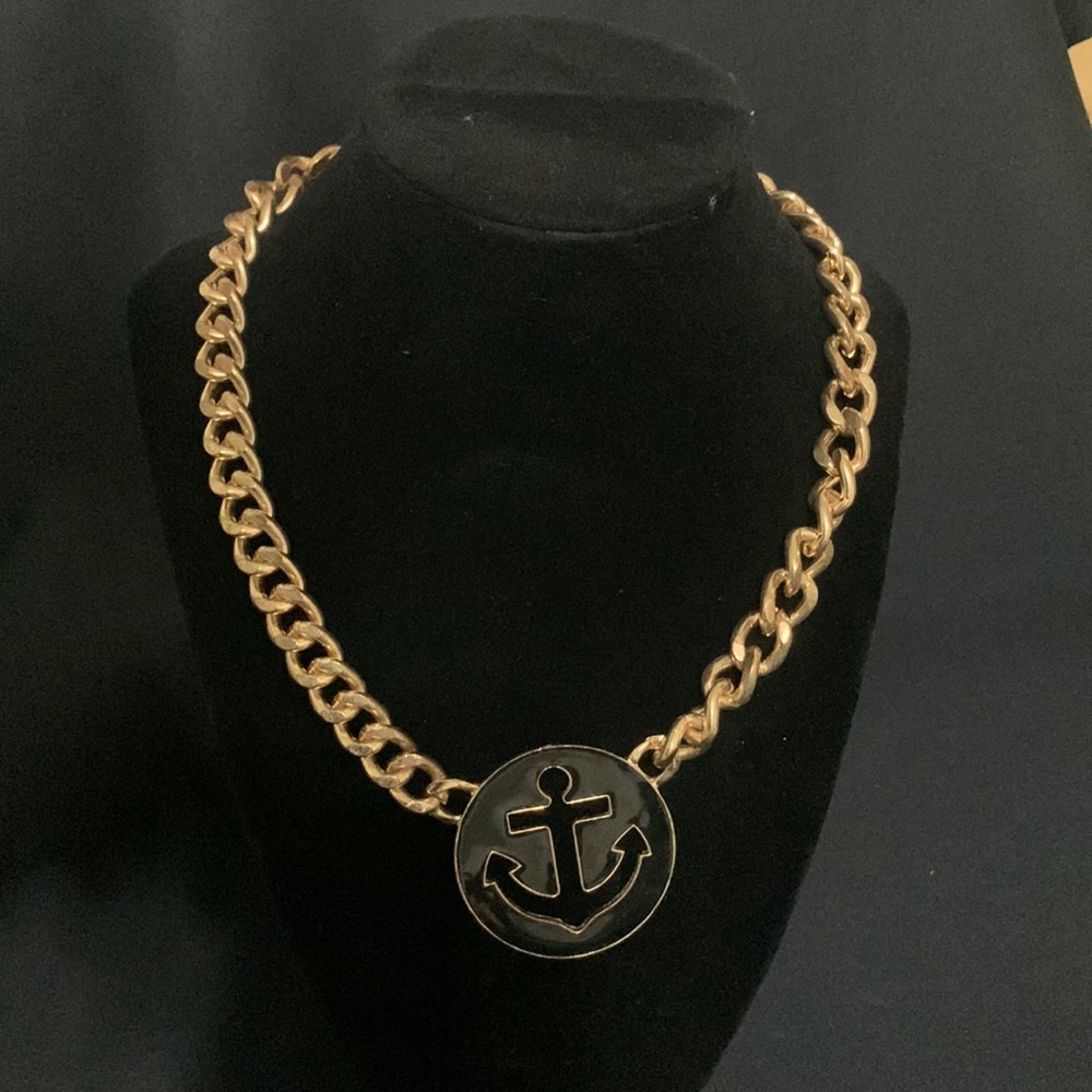 Anchor pendant necklace with gold chain and black laser cut design